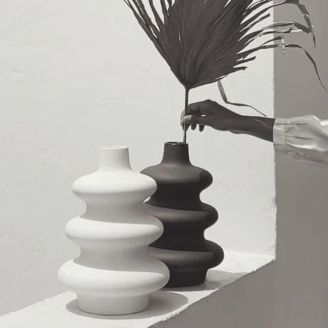 Sculptural black Mezo Vase displayed as a contemporary decorative accent.