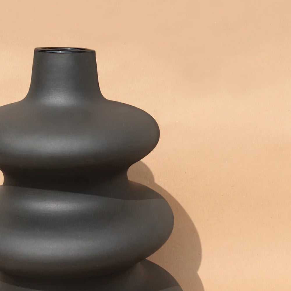 Side view of the Osmos Studio Mezo Vase showing its distinctive contoured shape.