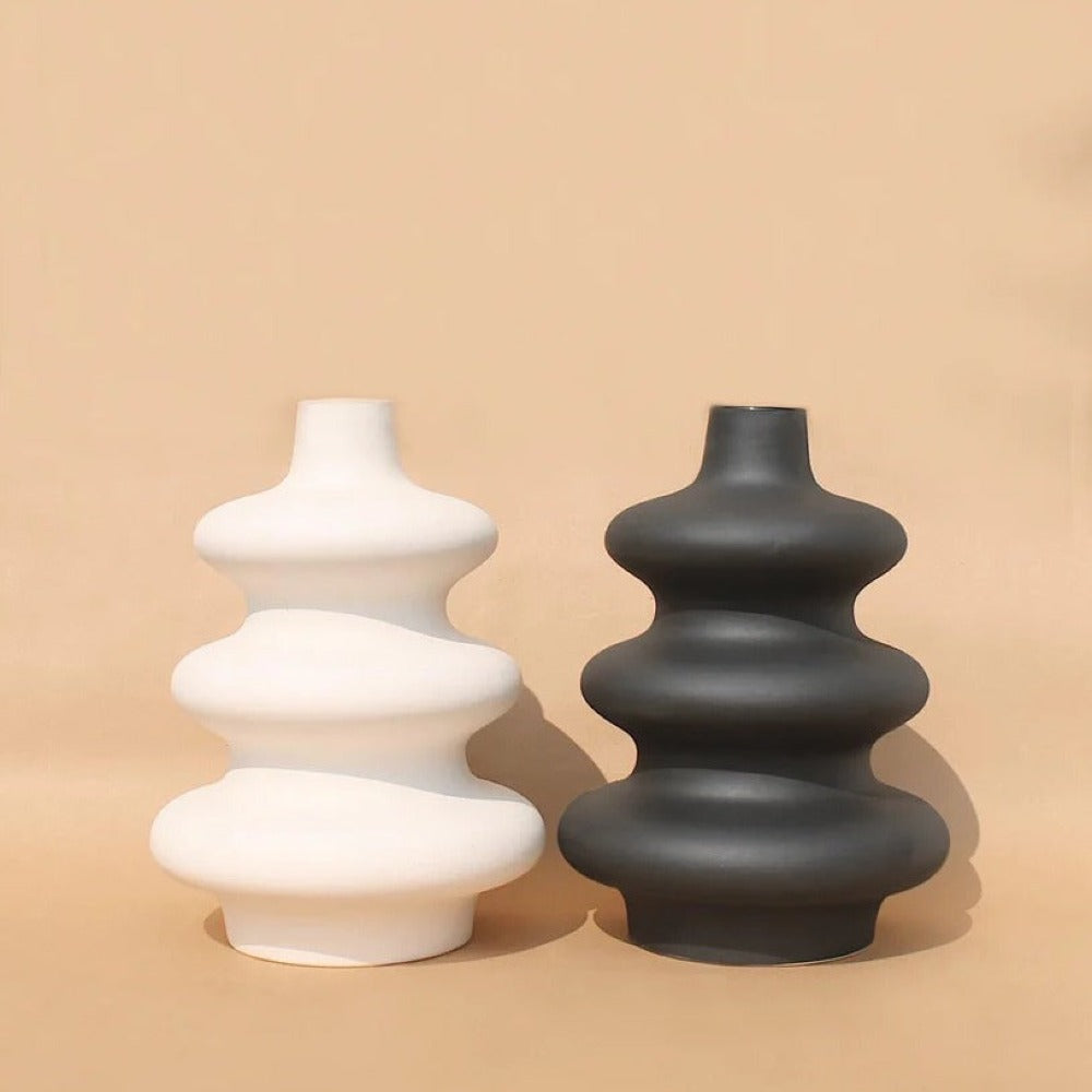 : White Mezo decorative vase with soft organic curves and a modern minimalist finish.