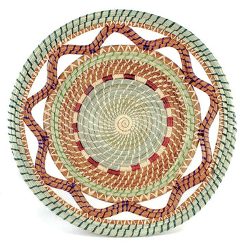 Celestina handwoven basket crafted from pine needles, pajon grass and colorful raffia.