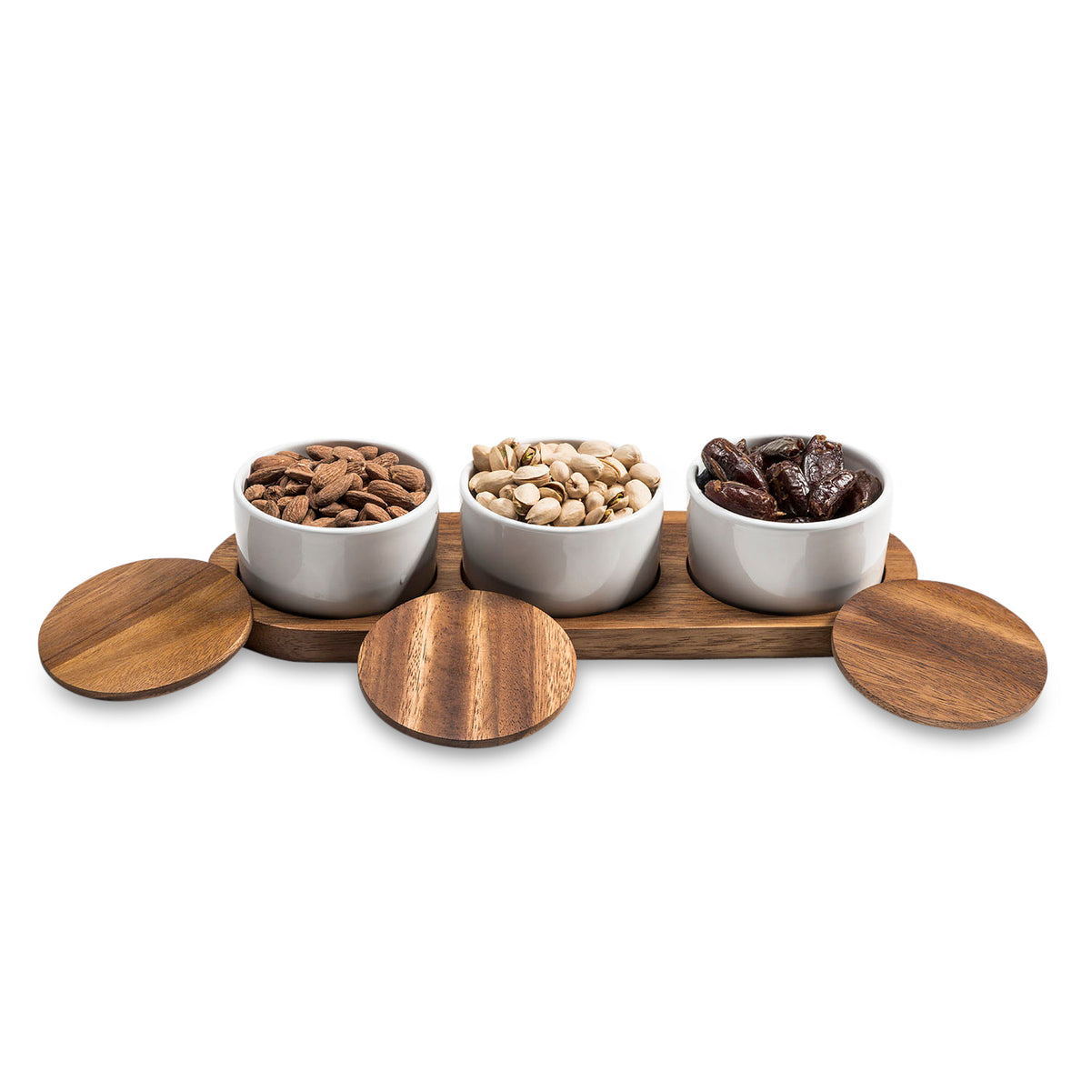 Three white bowls on a wooden tray with lids