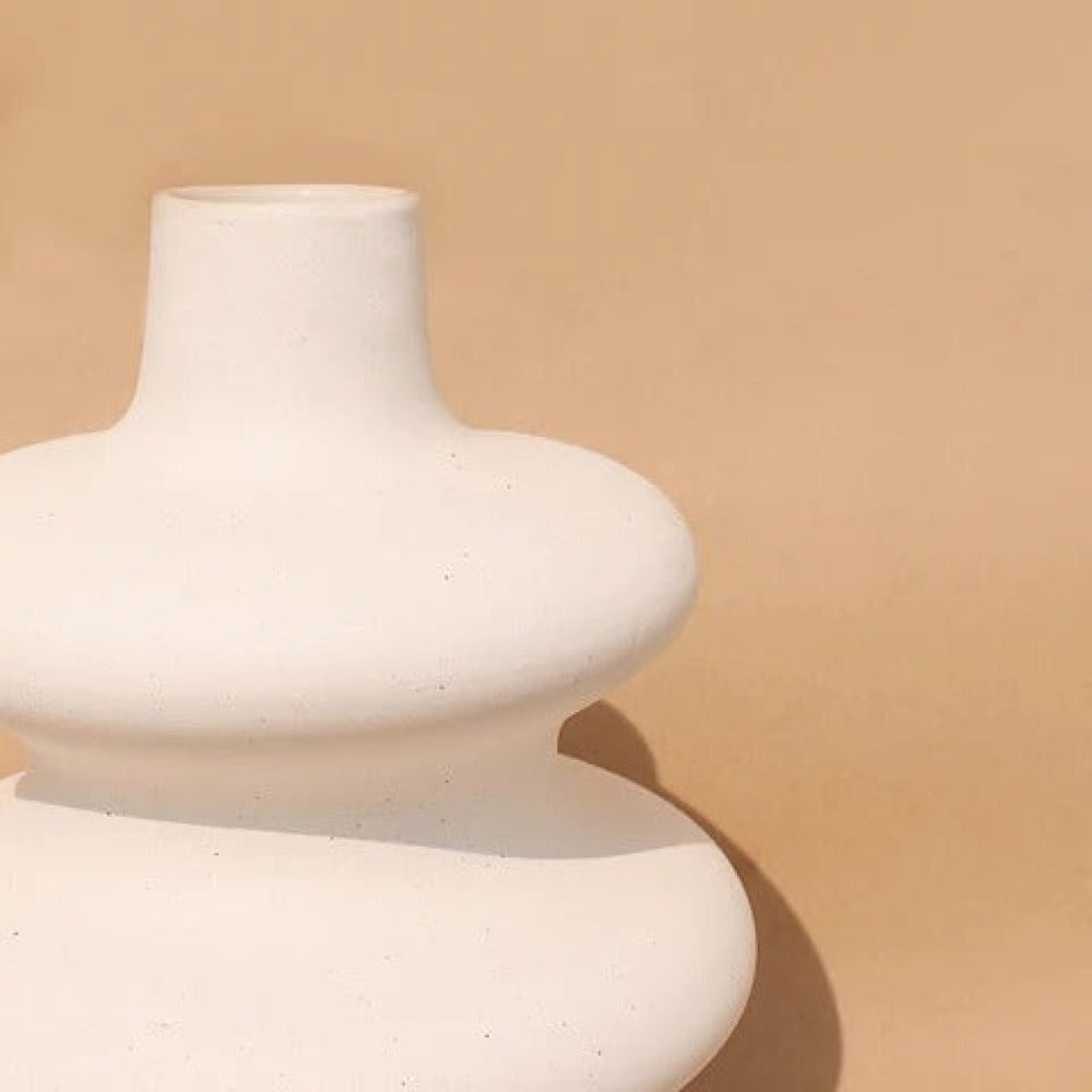 : White Mezo decorative vase with soft organic curves and a modern minimalist finish.